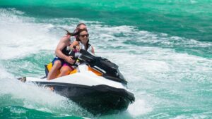 Two people on a jet ski in the oceam